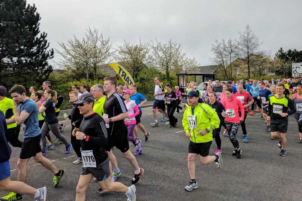 Runners pound the pavement during the 10K road race