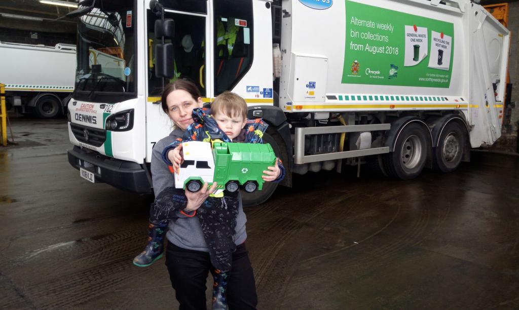 Axl and his mother pictured with a toy bin wagon