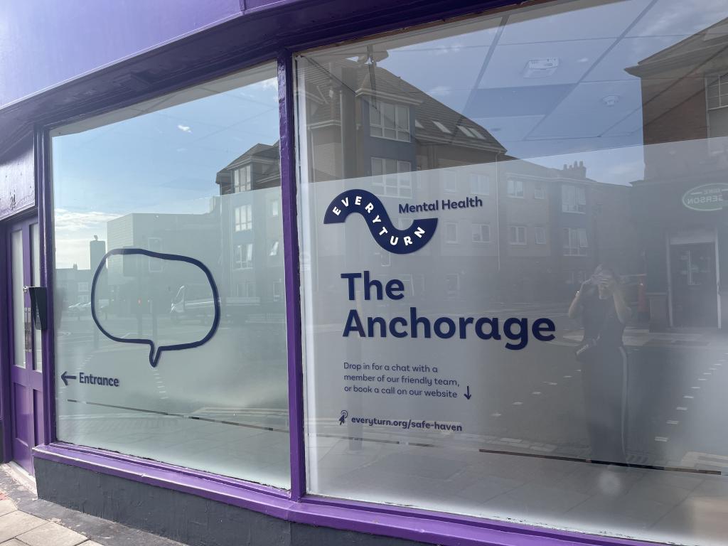 Picture of purple building with sign 'The Anchorage'