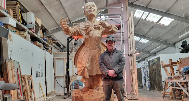 Artist Keith Barrett with the wooden carving of Mary Ann Macham, about to be cast in bronze. 