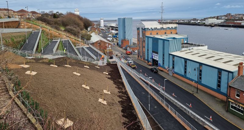 The Riverside Embankment Walkway seen from above, a series of zigzag footpaths 