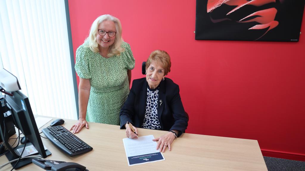 Dame Norma Redfearn signs UK100 pledge