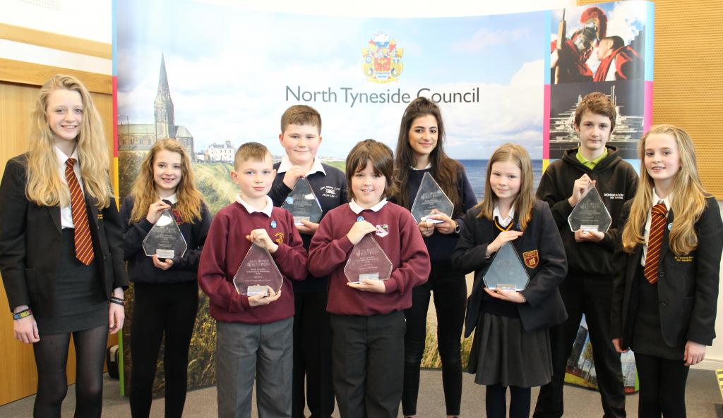 Former Young Mayor, Abbie Armstrong, far left, and Young Cabinet Member for anti-bullying, Abbie Herron, far right, with children from Holy Cross R.C. Primary School.