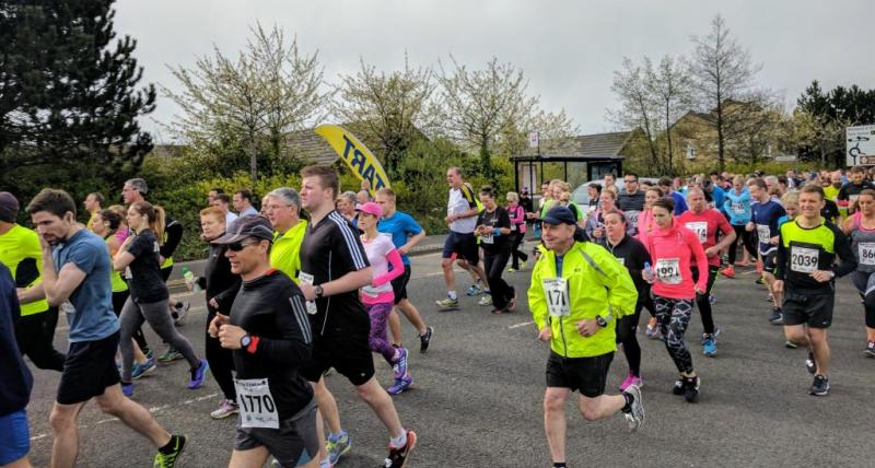 Runners pound the pavement during the 10K road race