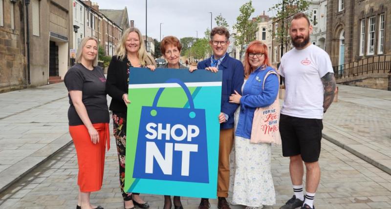 local business owners with elected mayor Norma Redfearn holding 'ShopNT' sign