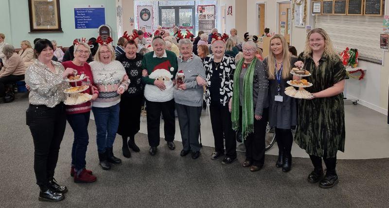 Female veterans, members of the community and Salute Her staff share a Christmas afternoon tea at the John Willie Sams Centre in Dudley, funded by UKSPF. Female veterans, members of the community and Salute Her staff share a Christmas afternoon tea