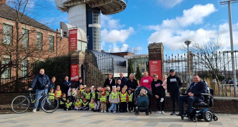 Members of the Wallsend community, local businesses, nursery school children, ward members and Cabinet Member for Climate Emergency Councillor Sandra Graham on the new active travel route outside Segedunum. 