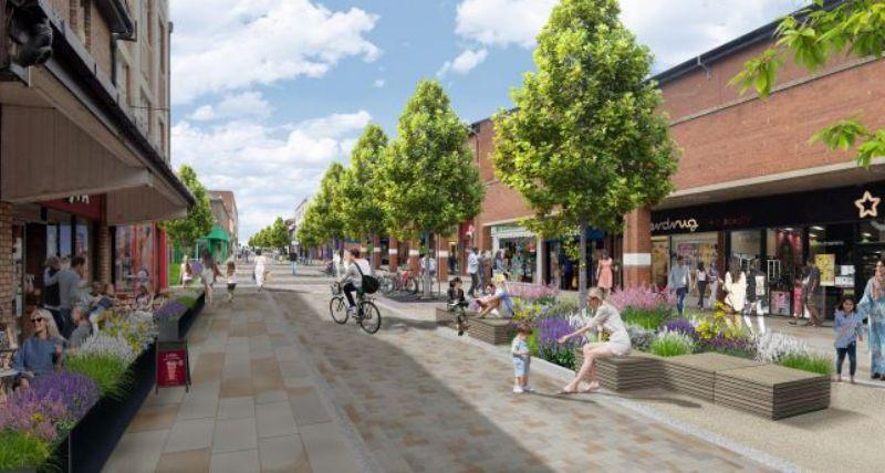 An artists’ impression of the finished scheme showing the new layout and people shopping and sitting An artists’ impression of the finished scheme showing the new layout and people shopping and sitting
