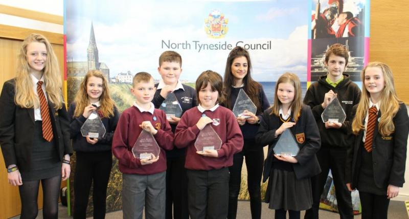 Former Young Mayor, Abbie Armstrong, far left, and Young Cabinet Member for anti-bullying, Abbie Herron, far right, with children from Holy Cross R.C. Primary School.