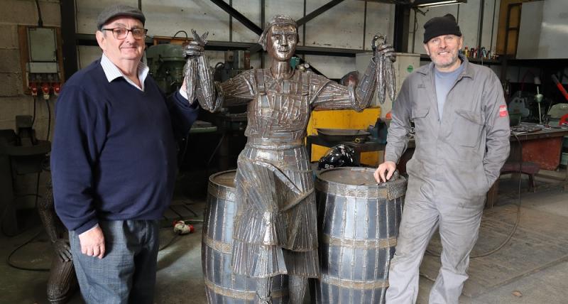 Terry McDermott and Ray Lonsdale with the Herring Girl sculpture